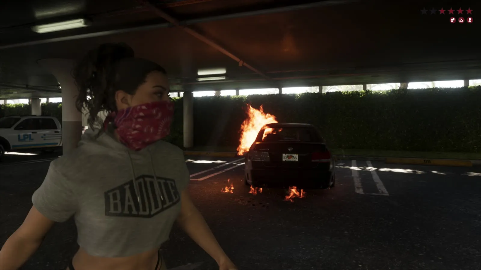 Lucia beside a burning car in a Bayside parking garage, from the GTA 6 Extended Look
