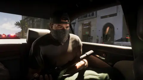 A masked shooter working the carbine out of a moving car during the getaway, from the GTA 6 Extended Look