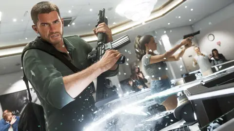 Jason with a carbine and Lucia with a pistol in a jewellery store, shattered display glass still in the air
