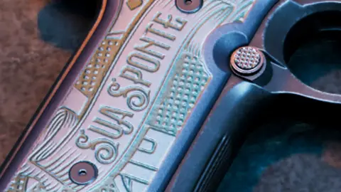 Close-up of the engraved grip on Jason's Girardi ES9 reading SUA SPONTE