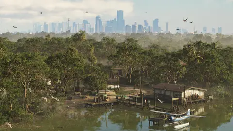 A wooden settlement on the water in the wetlands with a moored seaplane and the Vice City skyline behind