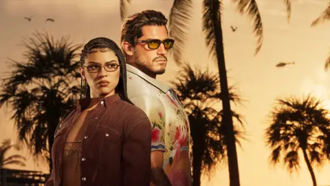 Jason and Lucia back to back at sunset in their Ultimate Edition looks, palms behind them