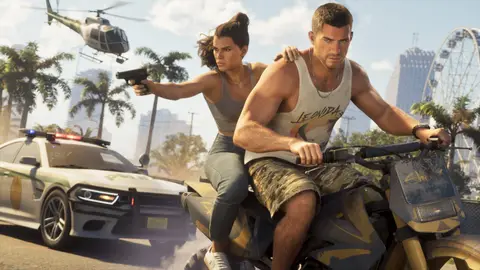 Jason riding a dirt bike through Vice City while Lucia fires a pistol back at a police car
