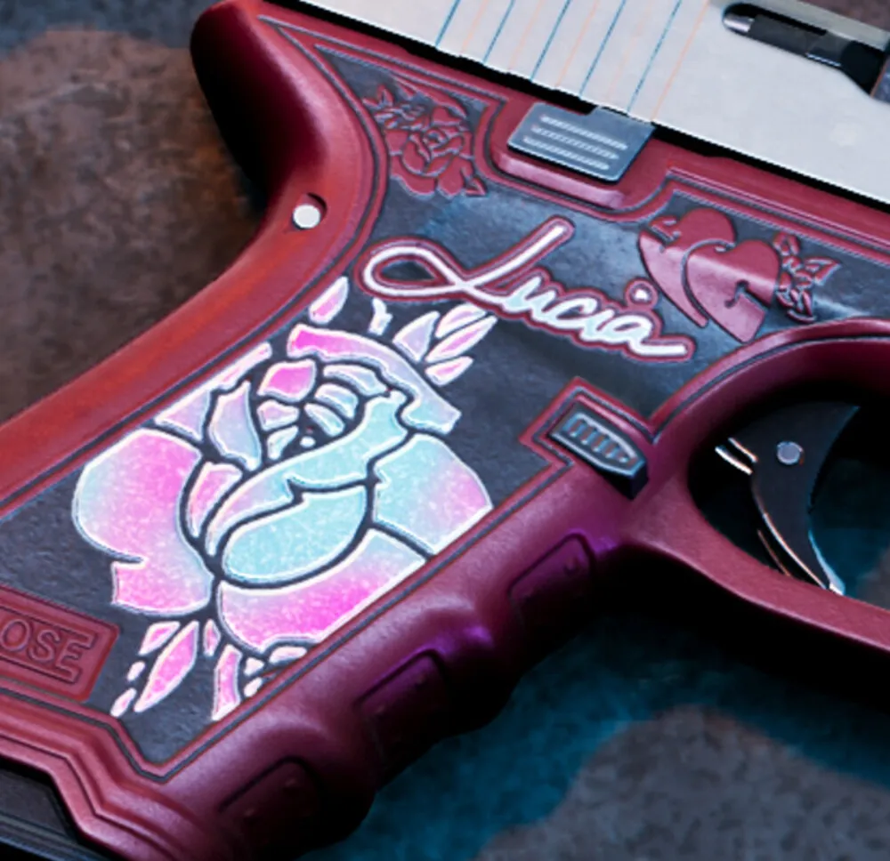 Close-up of the painted grip on Lucia's Klose K17 with the rose and her name in script