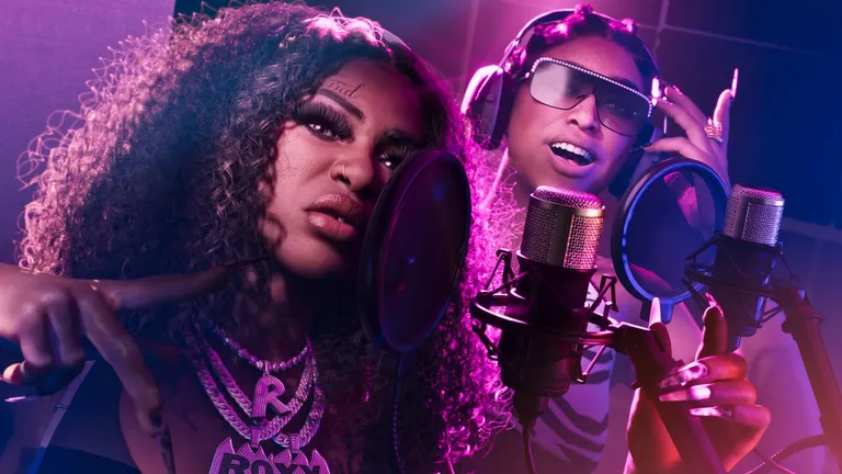 Real Dimez official artwork from the GTA VI website - the duo speaking into microphones in a recording studio