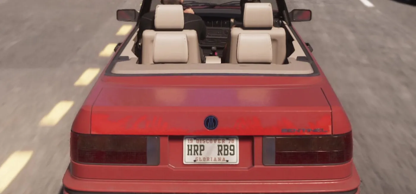 The SENTINEL badge and Übermacht roundel on the boot lid of the red convertible, from the GTA 6 Extended Look
